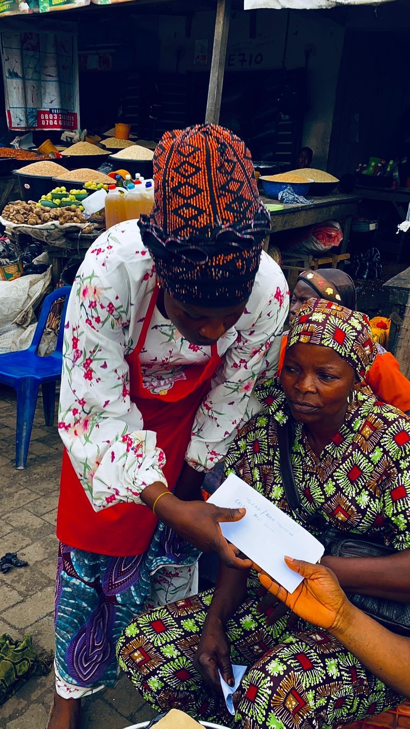 TOFAHF volunteer distributing support in a local market